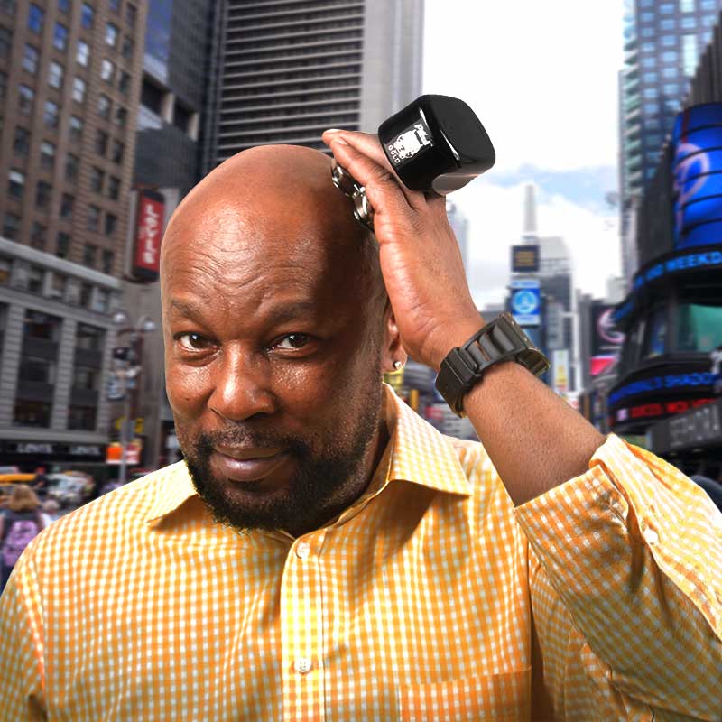 Man shaving his head with a Pitbull Gold PRO shaver outdoors